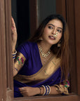 Sakshi in our Violet Paithani Silk Saree with Half Half Concept Big Border Zari Woven Saree