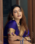 Sakshi in our Violet Paithani Silk Saree with Half Half Concept Big Border Zari Woven Saree