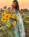 Monika in our Sea Green Chanderi Cotton Pichwai Printed Saree with Zari Woven Border