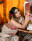 Peach Assam Silk Floral Printed Saree with Zari Woven Border