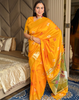 Orange Soft Silk Ikkat Patola Saree with Meenakari Motifs Peacock Pallu and Gold Zari Border
