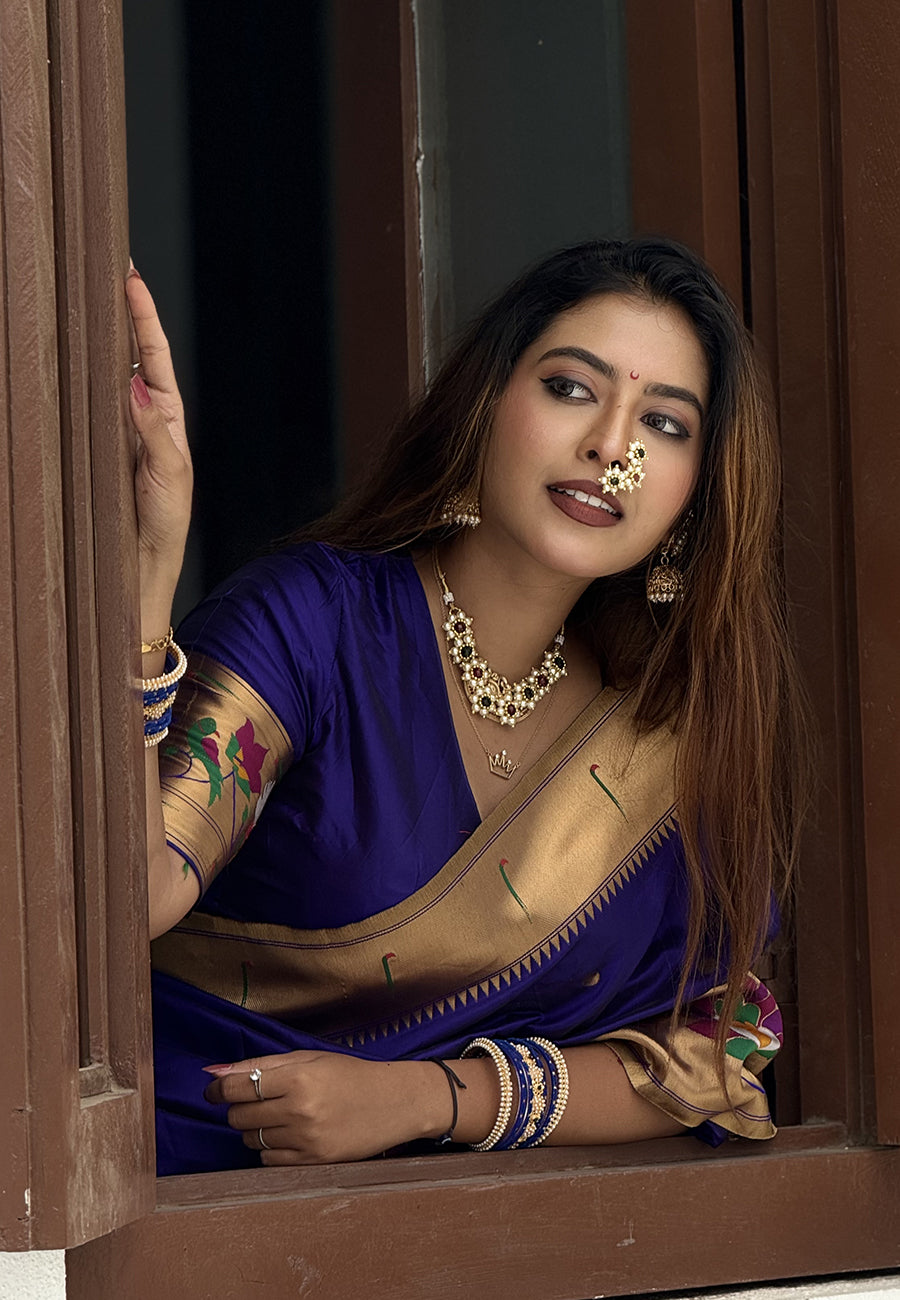 Sakshi in our Violet Paithani Silk Saree with Half Half Concept Big Border Zari Woven Saree