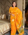 Orange Soft Silk Ikkat Patola Saree with Meenakari Motifs Peacock Pallu and Gold Zari Border